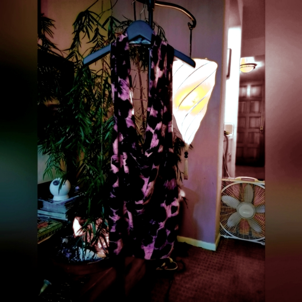 Short dress, backless, no zippers or buttons to fasten. One piece